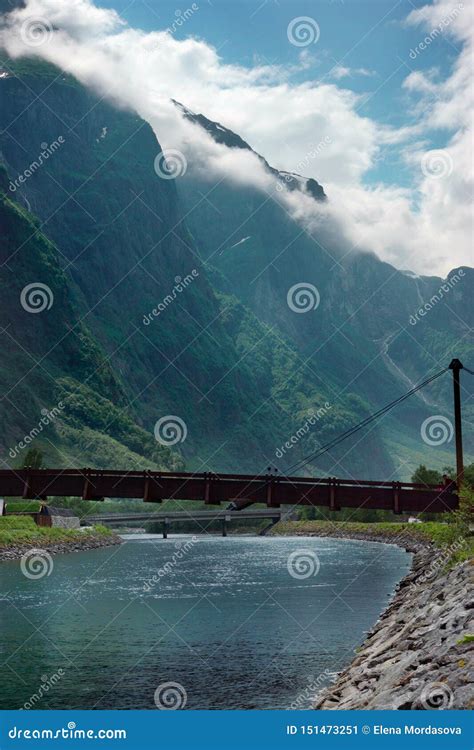 Travel To Norway, the Bridge Across the River between the Mountains Stock Image - Image of ...