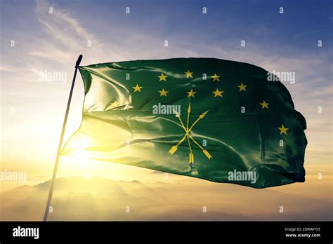 Circassia flag waving on the top sunrise mist fog Stock Photo - Alamy