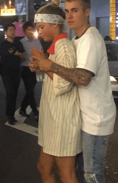 Justin Bieber & Sofia Richie Hold Hands & Cuddle In Japan