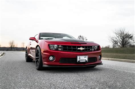 Red Chevrolet Camaro On The Road · Free Stock Photo