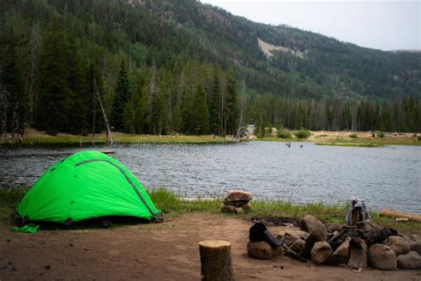 Green Tent Camping Next To Lake Stock Photo - Image of clothes ...