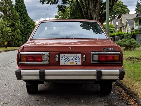 Old Parked Cars Vancouver: 1979 Datsun 210 Sedan