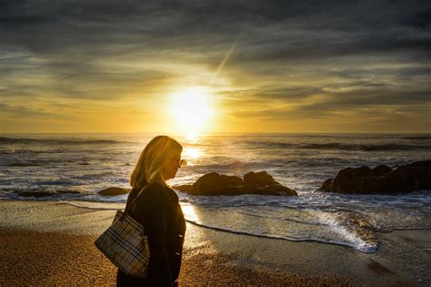 woman-walking-on-the-beach-during-sunset image - Free stock photo ...