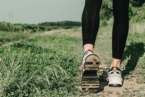 Runner woman feet running on road closeup on shoe. Sports healthy lifestyle concept - Creative ...