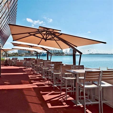 Dining with a view under a #poggesiusa umbrella. Breathtaking sceneries from the Hard Rock Cafe ...