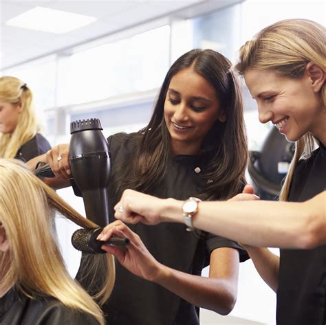 Teacher Helping Students Training To Become Hairdressers - Rush Careers