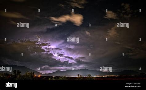 The purple clouds in the night sky Stock Photo - Alamy