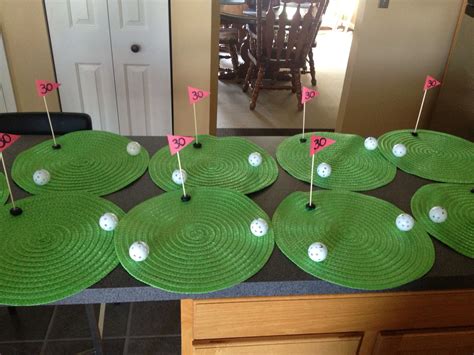Golf themed birthday party. These center pieces were made from dollar store mats, plastic gold ...