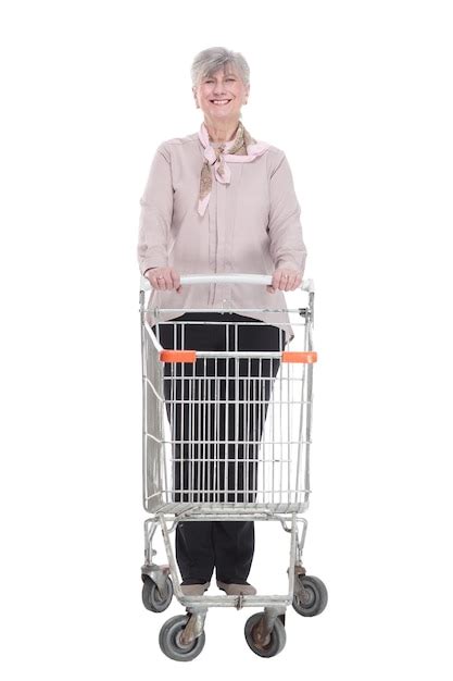 Premium Photo | Smiling old lady with a shopping cart isolated on a white background