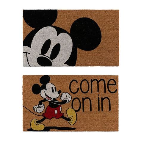 two mickey mouse door mats with the words come on in
