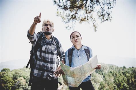 Young adventure couple hiking to a mountain 1954006 Stock Photo at Vecteezy