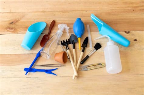 Premium Photo | Small gardening tools set with wooden background