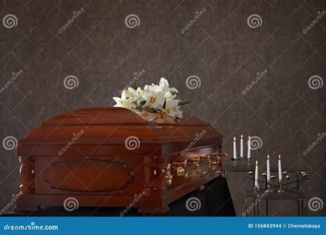 Casket with White Lilies in Funeral Home Stock Photo - Image of background, candles: 156843944