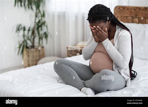 Sad Black Pregnant Woman Crying At Home, Having Maternity Depression ...