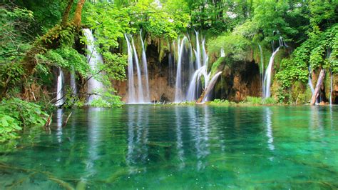 Green nature - beautiful waterfall and mountain lake