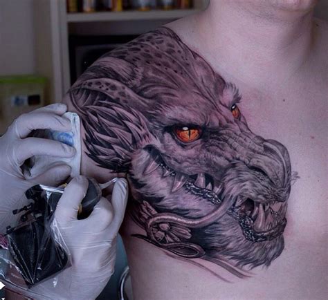 Dragon's Head with Fiery Oeage Eyes | Best tattoo design ideas