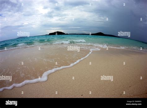 Storm approaches Nukuifala Islet, viewed from Nukuione Islet, Uvea ...