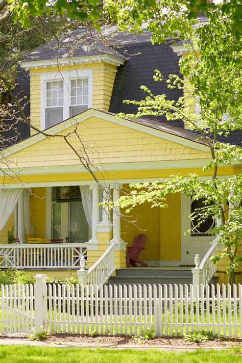 Soft Yellow Yellow Exterior House Paint Colors - Nicely designed soft yellow suburban home with ...