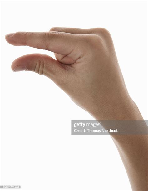 Boy Making Pinching Gesture Closeup Of Hand High-Res Stock Photo ...