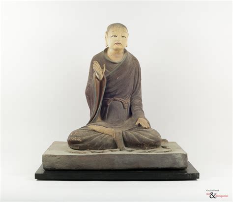 A Painted Clay Ming Dynasty Sculpture of a Luohan, c. 1368-1644