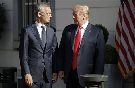 Trump kicks off NATO summit with jab at Germany