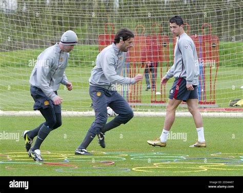 Roy Keane (L) and Ruud Van Nistelrooy (C) are watched by Cristiano ...