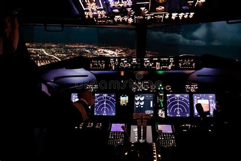 Pilot in Airplane Cockpit in the Night Flying Over the City Stock Image ...