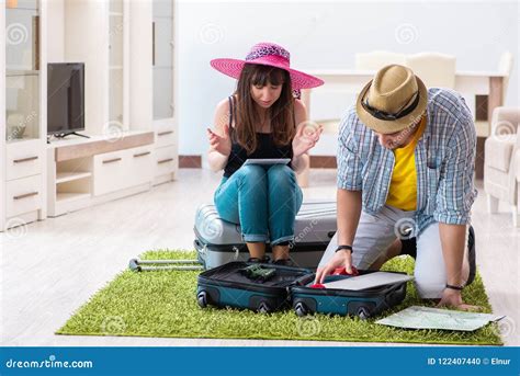 The Young Family Packing for Vacation Travel Stock Photo - Image of registration, holiday: 122407440