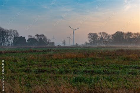 Ground fog in the dusk of the typical flat landscapes of East Frisia in the tourist resort of ...