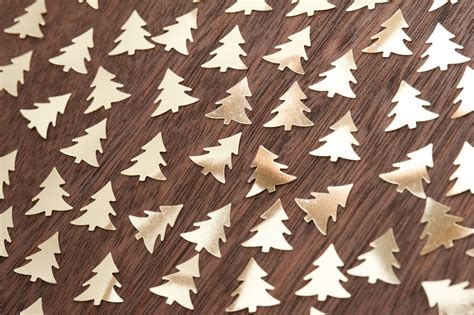 Photo of Many cut out golden fir trees | Free christmas images