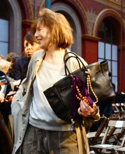 Jane Birkin recently in a Hermes desfilee holding her Birkin bag Jane ...