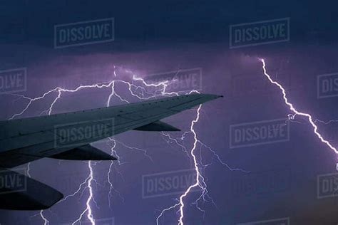 Thunderstorm and lightning seen from airplane - Stock Photo - Dissolve