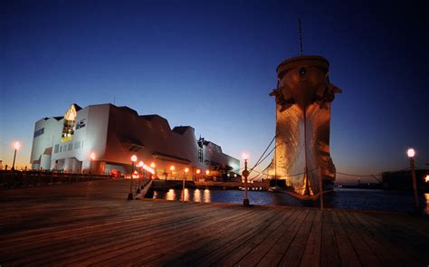 The USS Wisconsin (BB 64) adds grace to the Norfolk skyline in its new berthing assignment at ...