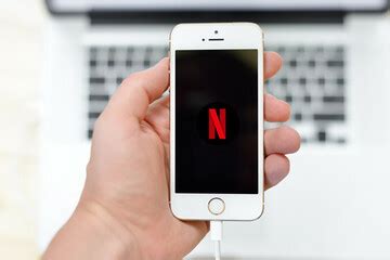 Netflix logo and Image | Somebody holding a mobile displayin… | Flickr