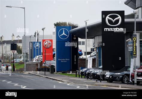 Mercedez Benz , MG and Mazda car dealership showroom in Portslade Brighton Sussex Stock Photo ...