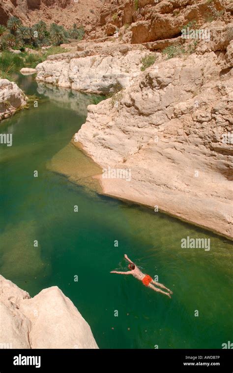 Swimming tourist, Wadi Tiwi, Oman Stock Photo - Alamy