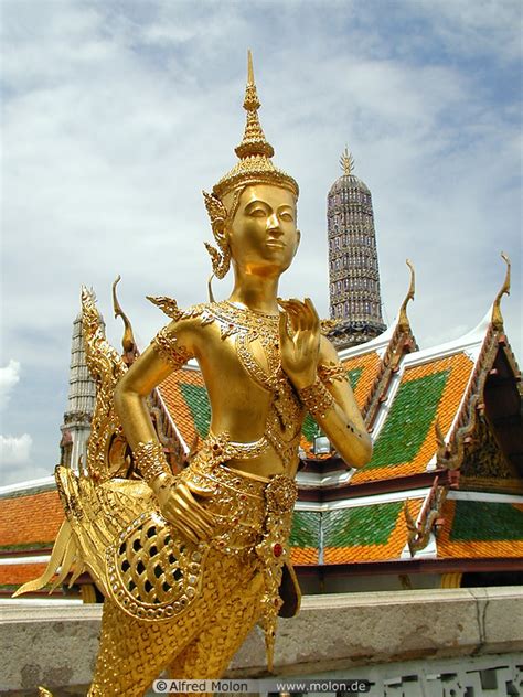 Photo of Golden Kinnara statue. Grand Palace, Bangkok, Thailand