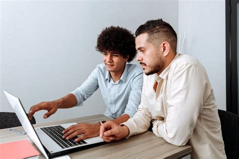 Men using Laptop while Working Together · Free Stock Photo