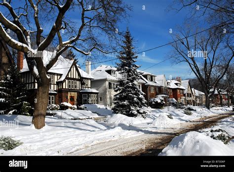 Suburban street with snowy houses, Canada or United States Stock Photo - Alamy