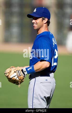 Los Angeles Dodgers catcher Brad Ausmus and Colorado Rockies Todd Helton watch the ball on ...