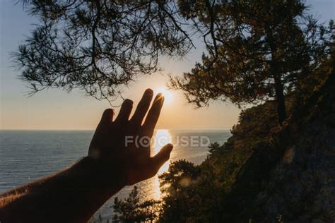 Man hand reaching for sun at sunset — male, people - Stock Photo ...