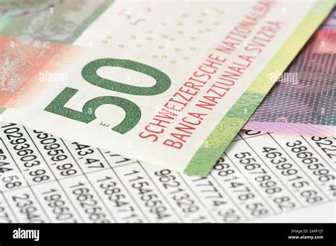 Swiss Franc banknotes and a spreadsheet Stock Photo - Alamy