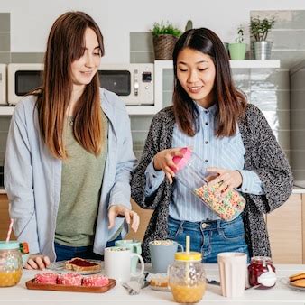 Free Photo | Relaxing cheerful girls cooking breakfast