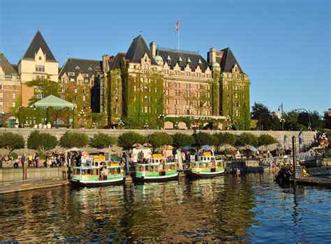 Harbour ferries at the foot of The Empress Hotel overlooking Victoria's Inner Harbour, British ...