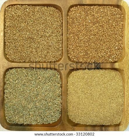 assorted grains (wheat, rye, bulgur and buckwheat) in a wooden square container - Stock Image ...