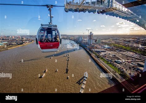 Emirates Air Line gondola cable car across the River Thames from the ...