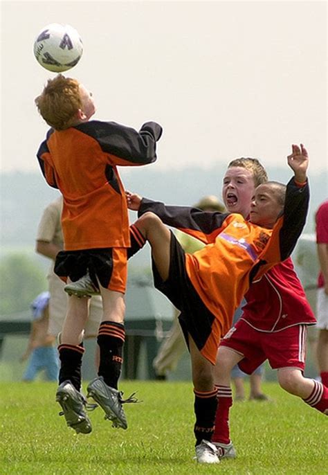 Kid getting kicked in the nuts while headbutting a soccer ball : r ...