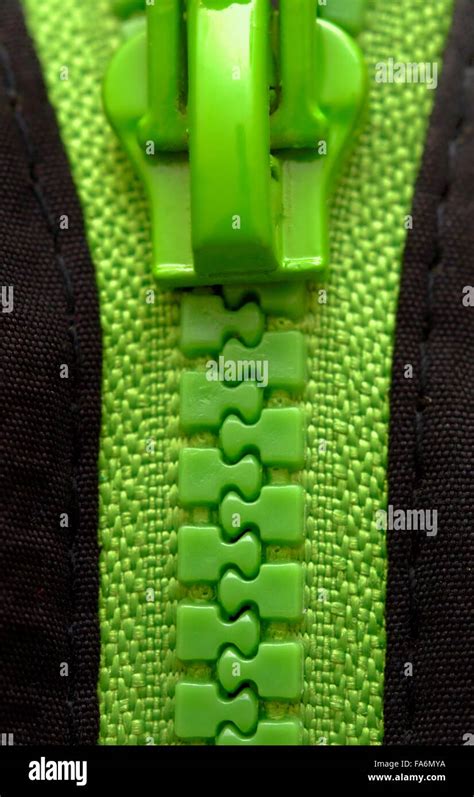 A green zipper close up Stock Photo - Alamy