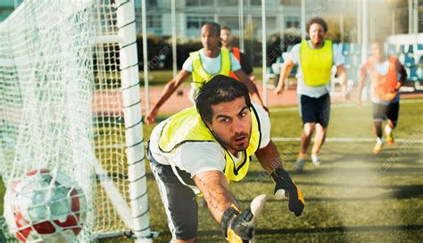 Goalie training on soccer field - Stock Image - F014/4680 - Science Photo Library