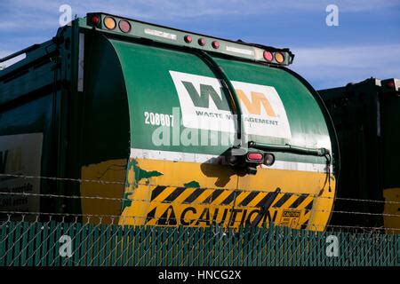 Logo signs on Waste Management, Inc., trucks in San Antonio, Texas on ...